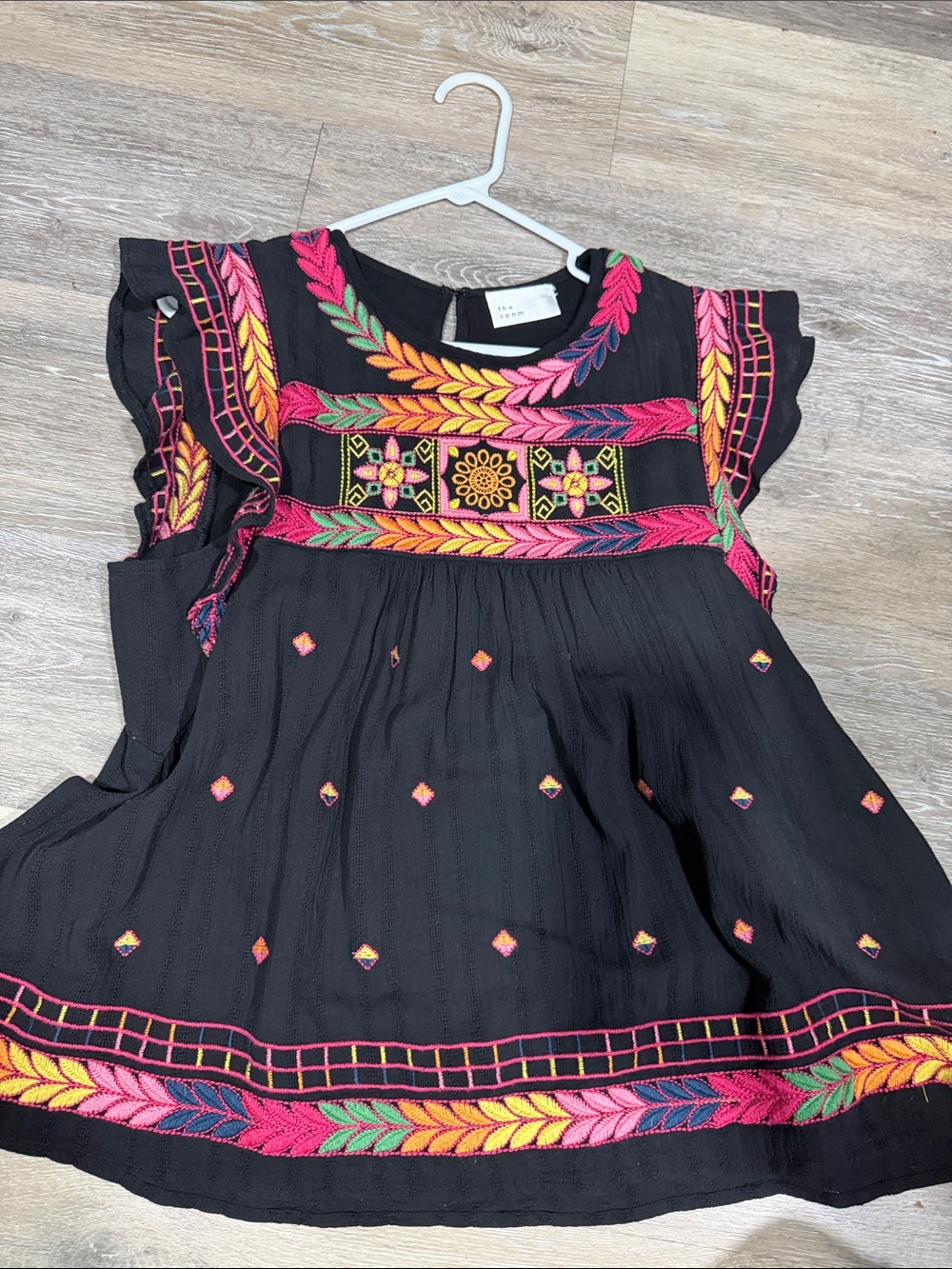 the room Black Embroidered Flutter Sleeve Top with Pink, Yellow & Green Accents